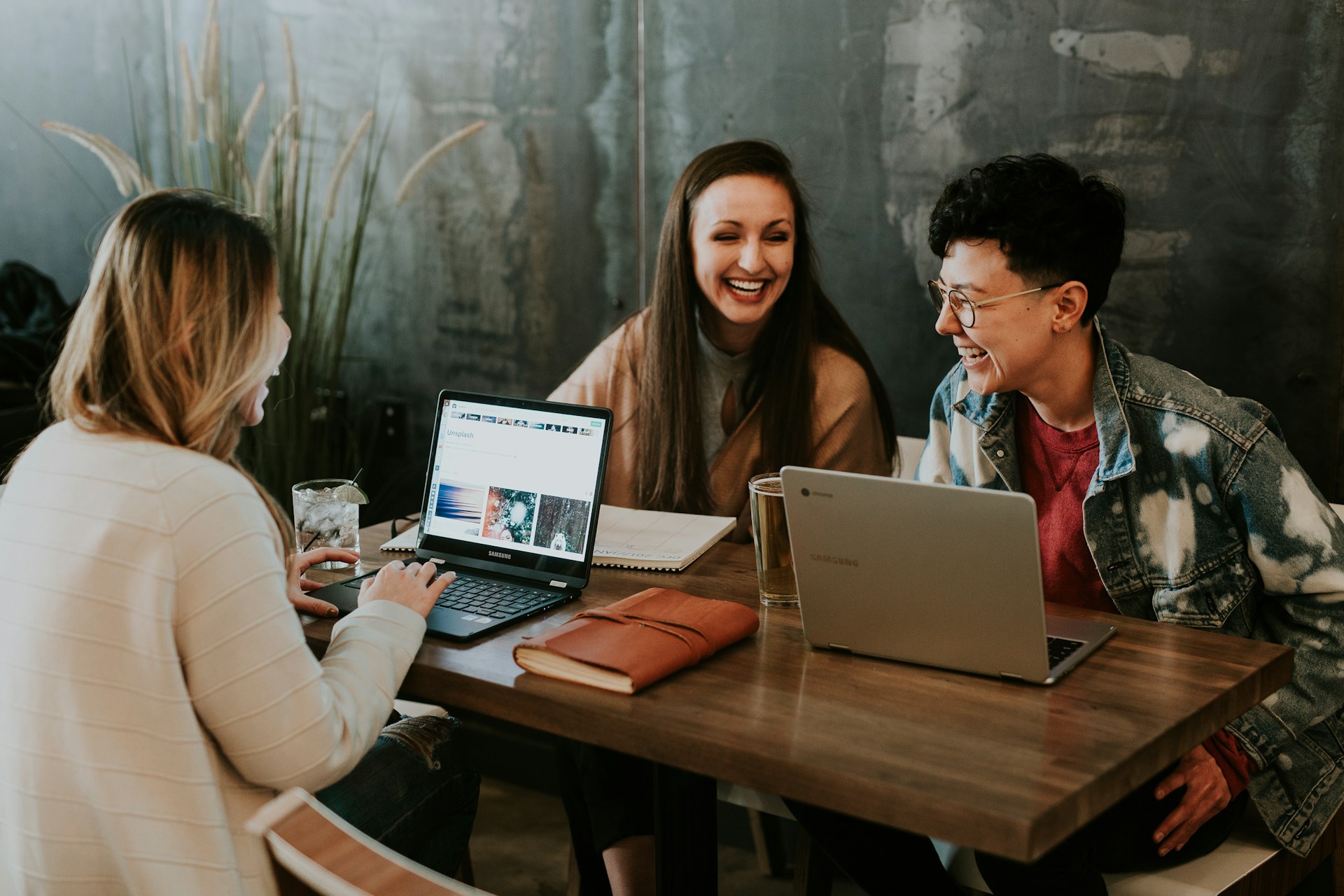 people enjoying their work around a desk